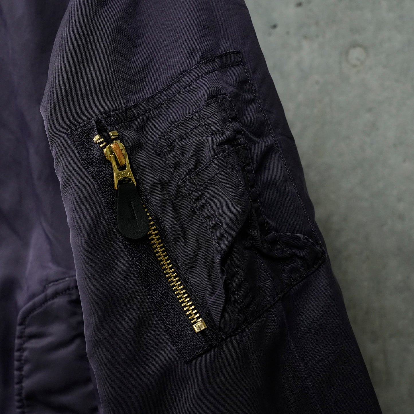 GARMENT DYE PADDED BOMBER JACKET / UC