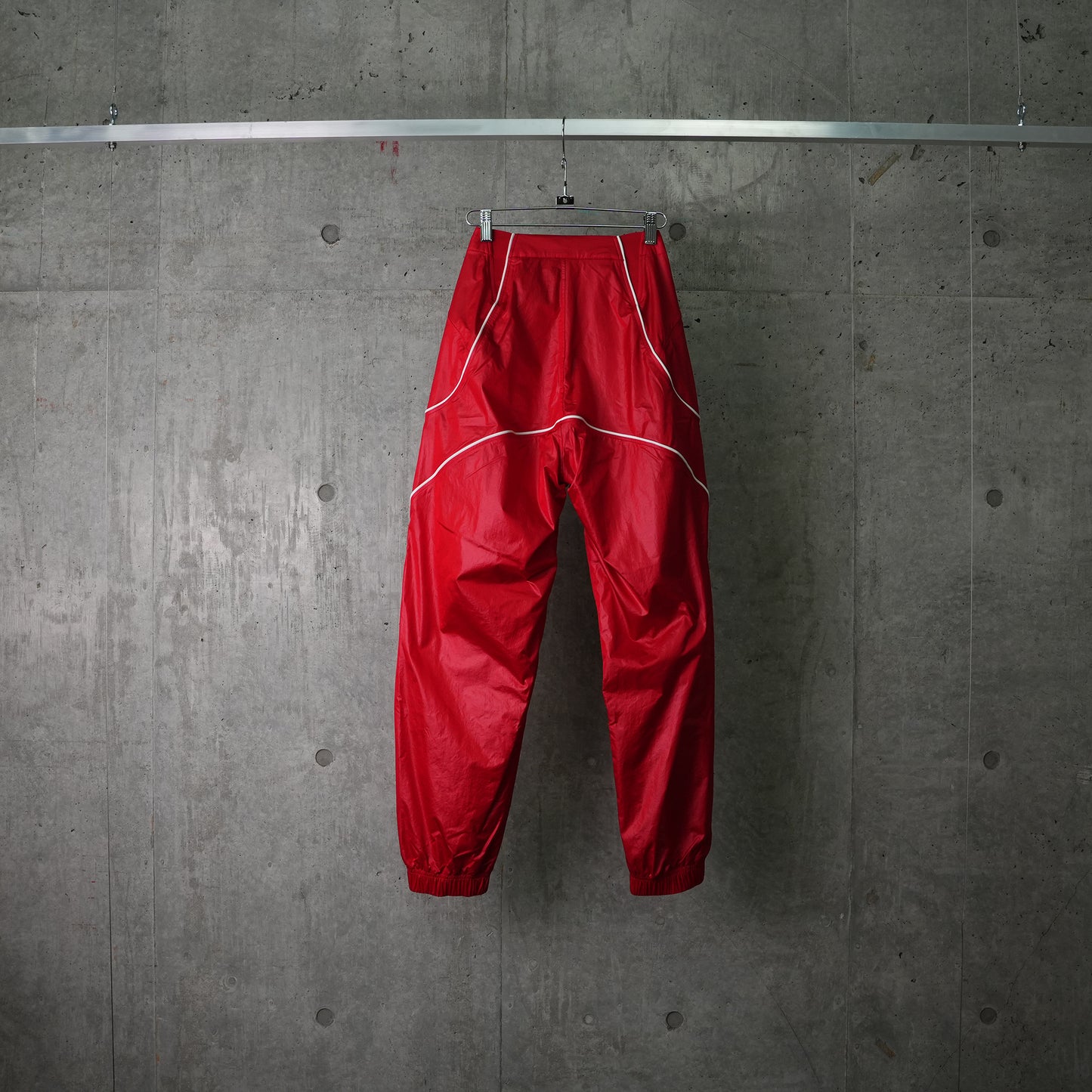 AS U NRG JACQUEMUS TRACK PANT / 642:MYSTIC RED/WHITE