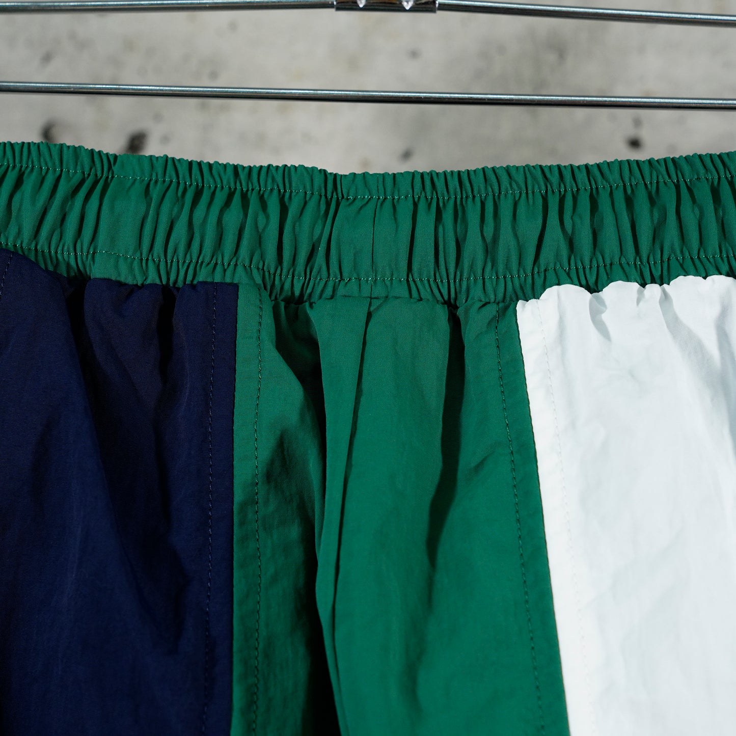 PANELED TRACK PANTS / NAVY/FOREST GREEN