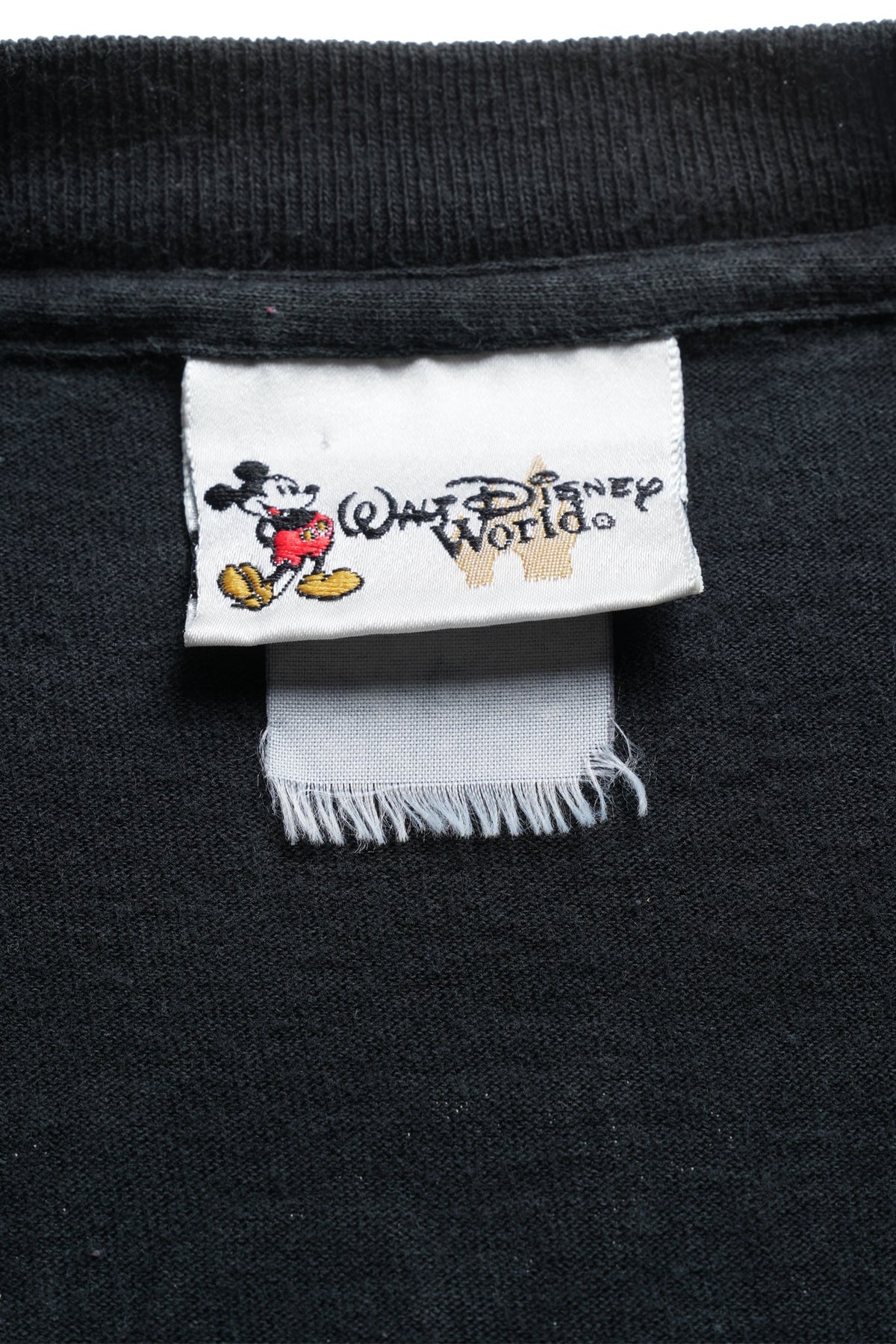 The Haunted Mansion “Watch for Hitchhiking Ghosts” Tee / BLACK