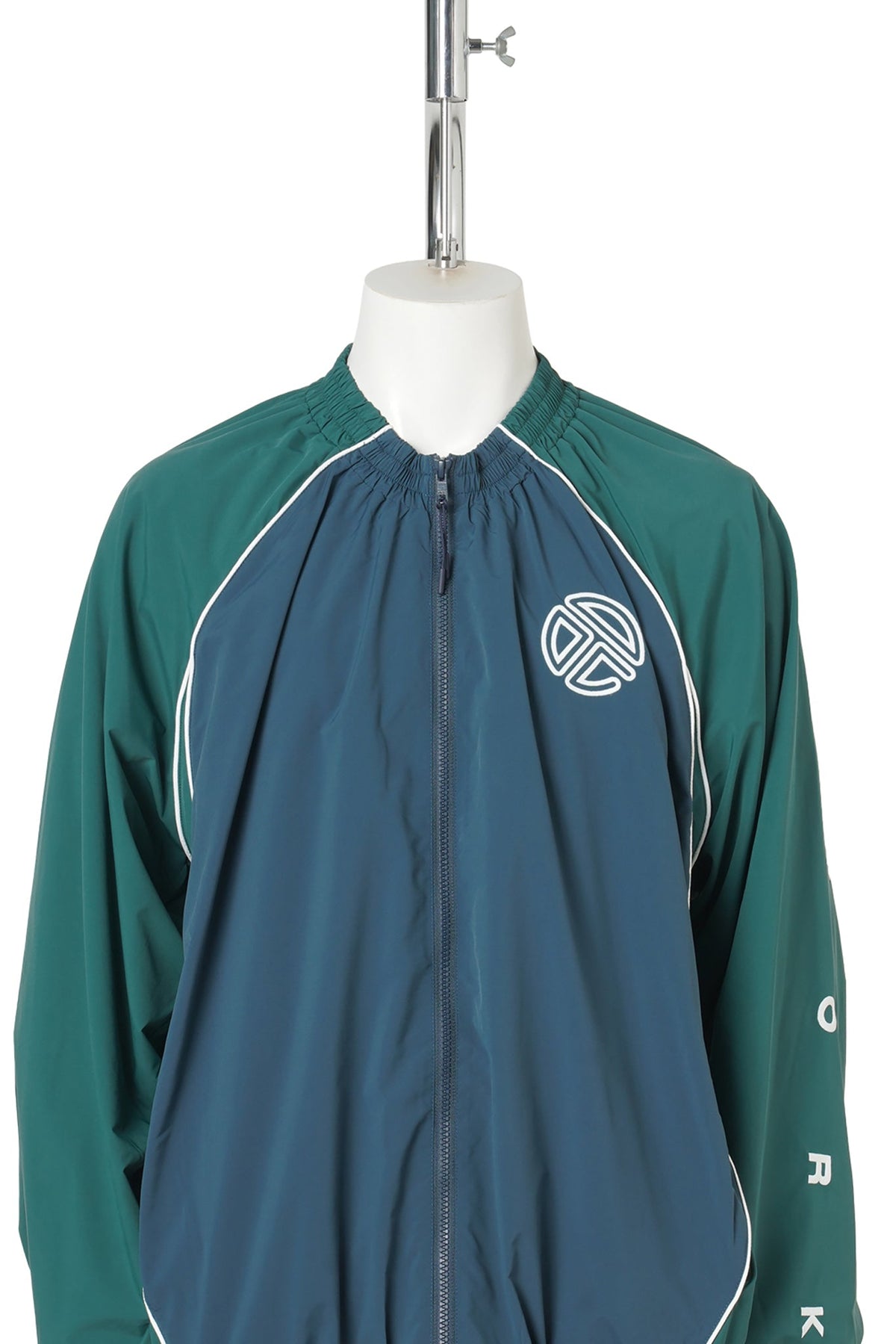 UPSIDE DOWN WINDBREAKER JACKET / GREEN/BLUE